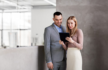 Image showing businesswoman and businessman with tablet pc