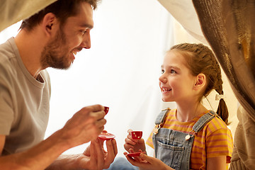 Image showing family playing tea party in kids tent at home