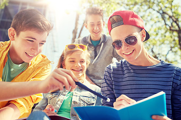 Image showing group of students with notebooks at school yard