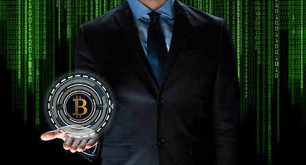 Image showing close up of businessman with bitcoin hologram