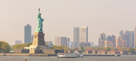 Image showing Statue of Liberty with Liberty State Park and Jersey City skyscrapers in background, USA