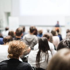 Image showing Woman giving presentation in lecture hall at university.