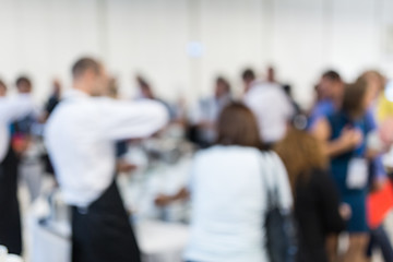 Image showing Blured image of businesspeople at coffee break at conference meeting.