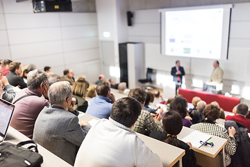 Image showing Business speaker giving a talk at business conference event.