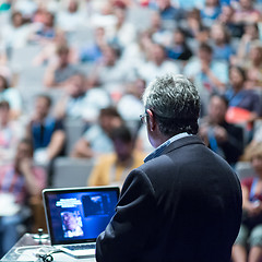 Image showing Public speaker giving talk at Business Event.