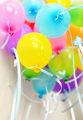 Image showing Bunch of floating colored balloons and strings 