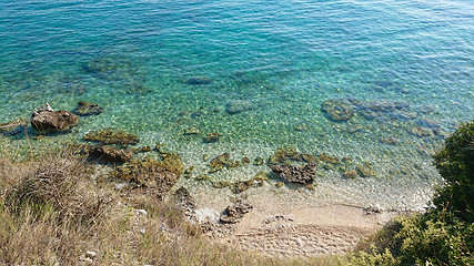 Image showing Rocky beach, bue transperent sea