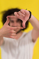 Image showing young man with funny hair over color background