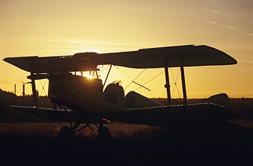 Image showing Sunset on  biplane Tiger Moth