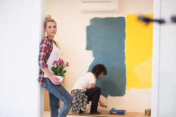 Image showing happy young couple doing home renovations