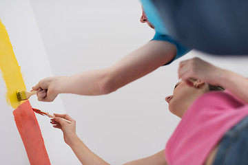 Image showing couple painting interior wall