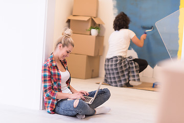 Image showing Happy couple doing home renovations