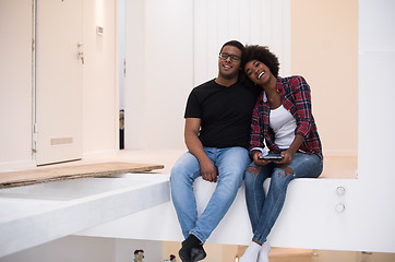 Image showing couple having break during moving to new house