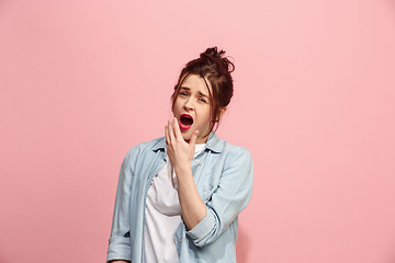 Image showing Beautiful bored woman bored isolated on pink background