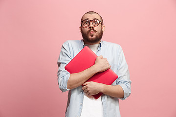 Image showing Businessman hugging laptop