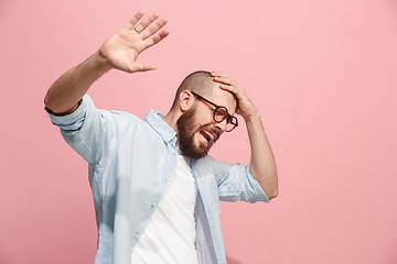 Image showing Portrait of the scared man on pink