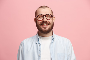 Image showing The happy business man standing and smiling against pastel background.
