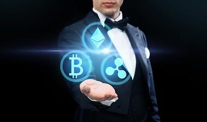 Image showing man in tailcoat with cryptocurrency holograms