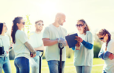 Image showing group of volunteers planting trees in park