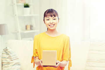 Image showing happy asian young woman with parcel box at home