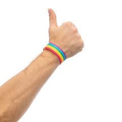 Image showing hand with gay pride rainbow wristband shows thumb