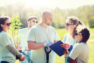 Image showing group of volunteers planting trees in park