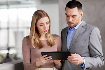 Image showing businesswoman and businessman with tablet pc