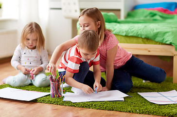 Image showing happy kids drawing at home