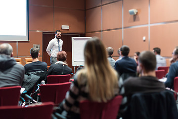 Image showing Skiled Public Speaker Giving a Talk at Business Meeting.