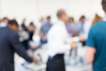 Image showing Blured image of businesspeople at coffee break at conference meeting.