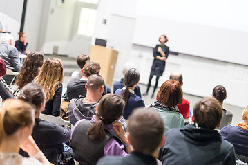 Image showing Woman giving presentation in lecture hall at university.