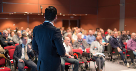 Image showing Public speaker giving talk at business event.