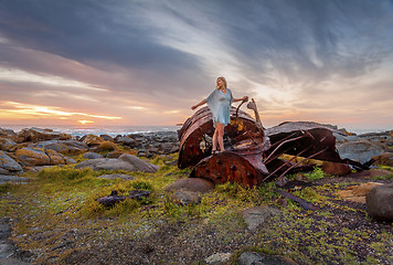 Image showing Female exploring rusting shipwrecks along Australian coast