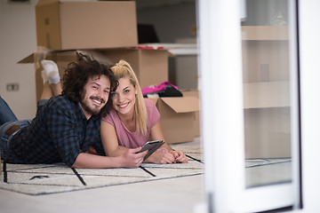 Image showing Young couple moving in a new flat