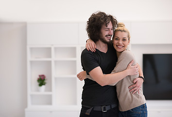 Image showing couple hugging in their new home