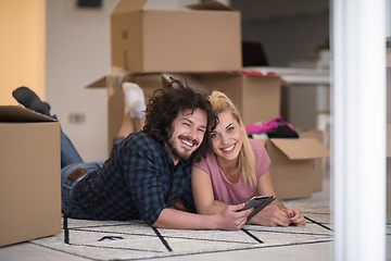 Image showing Young couple moving in a new flat