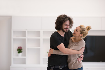 Image showing couple hugging in their new home