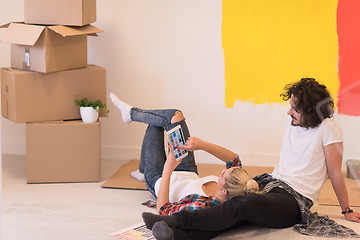 Image showing Happy young couple relaxing after painting