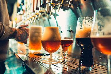 Image showing Glass of beer with barrel, bottle and fresh hops still-life