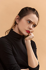 Image showing Young serious thoughtful business woman. Doubt concept.