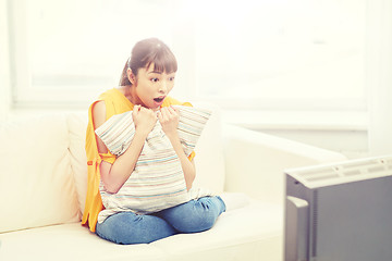 Image showing asian young woman watching tv at home