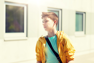 Image showing teenage student boy walking outdoors