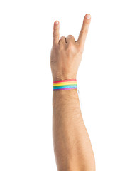 Image showing hand with gay pride rainbow wristband shows rock