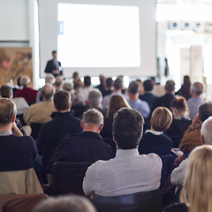Image showing Business speaker giving a talk at business conference event.