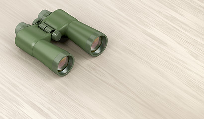 Image showing Military binoculars on wood background