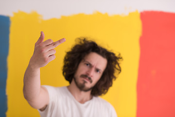 Image showing young man with funny hair over color background