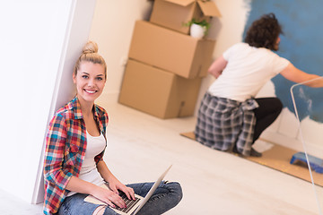 Image showing Happy couple doing home renovations