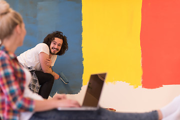 Image showing Happy couple doing home renovations