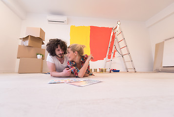 Image showing Happy young couple relaxing after painting