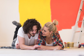 Image showing Happy young couple relaxing after painting